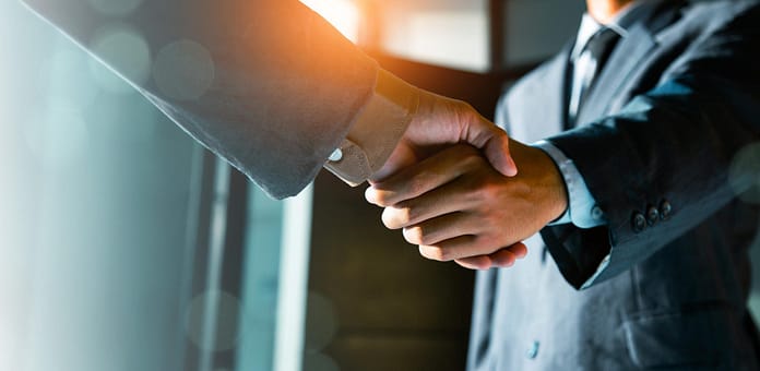 Trusted partner. Businessmen making handshake with partner, greeting, dealing, merger and acquisition, business cooperation concept, joint venture, Build trust in business and finance relationships.