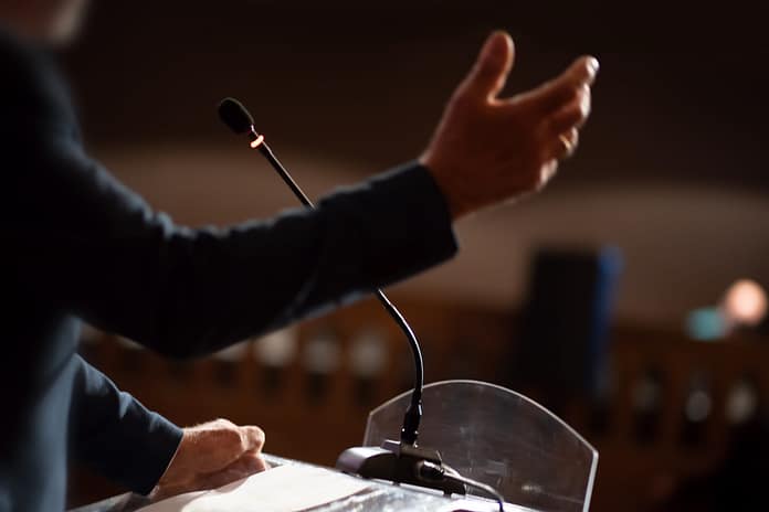 unrecognizable man having a speech