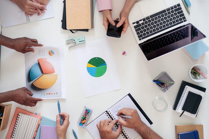 Business team analyzing data and planning strategy in office